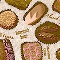 Chocolat - Tossed  Gourmet Chocolates on Textured Beige